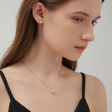 STMG Moissanite Diamond Stud Earrings on ear with matching necklace on neck