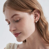 STMG Natural Pearl on Shell Stud Earrings on ear