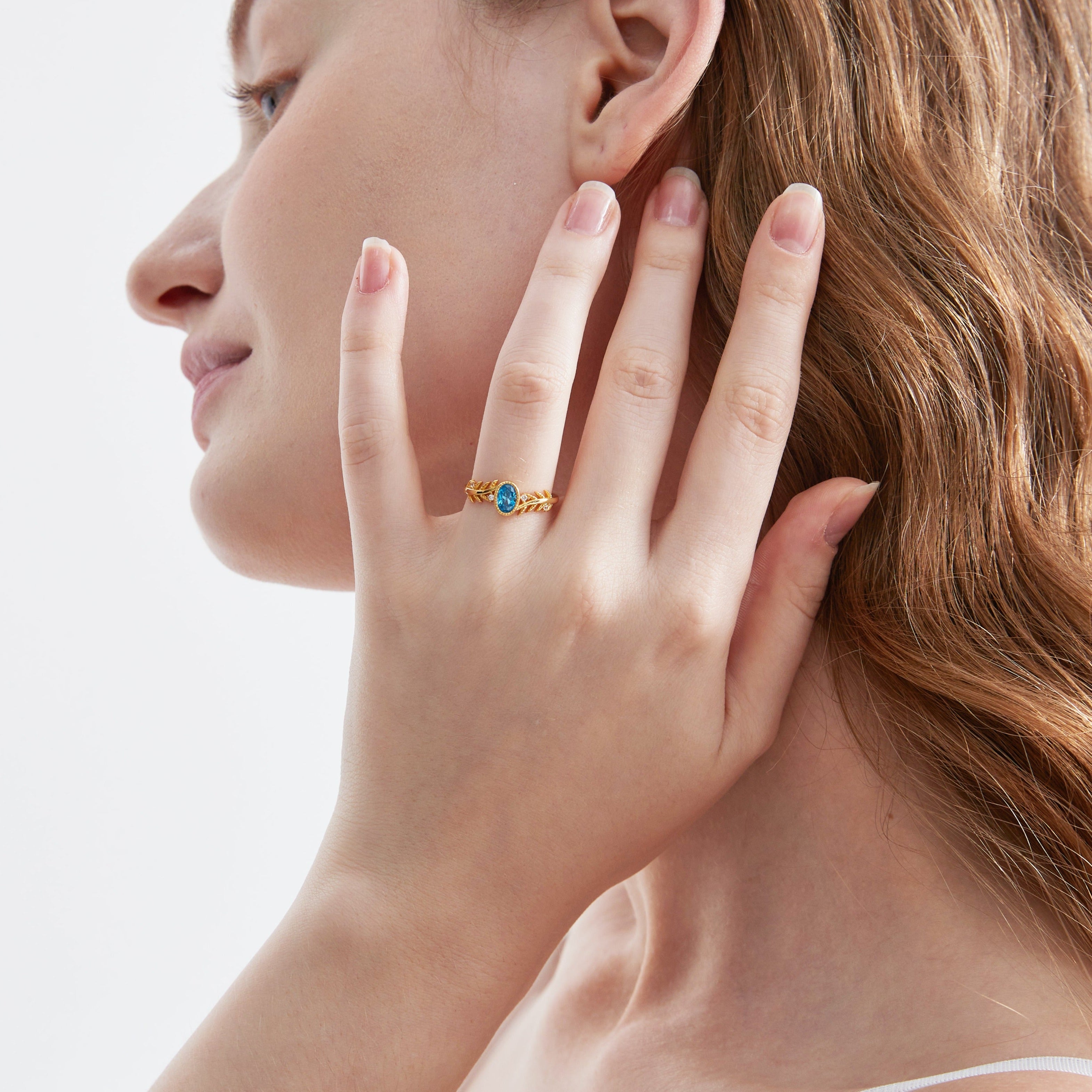 Blue Topaz on Olive Leaf Ring on hand