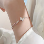 STMG Tiny Butterfly Bracelet on hand